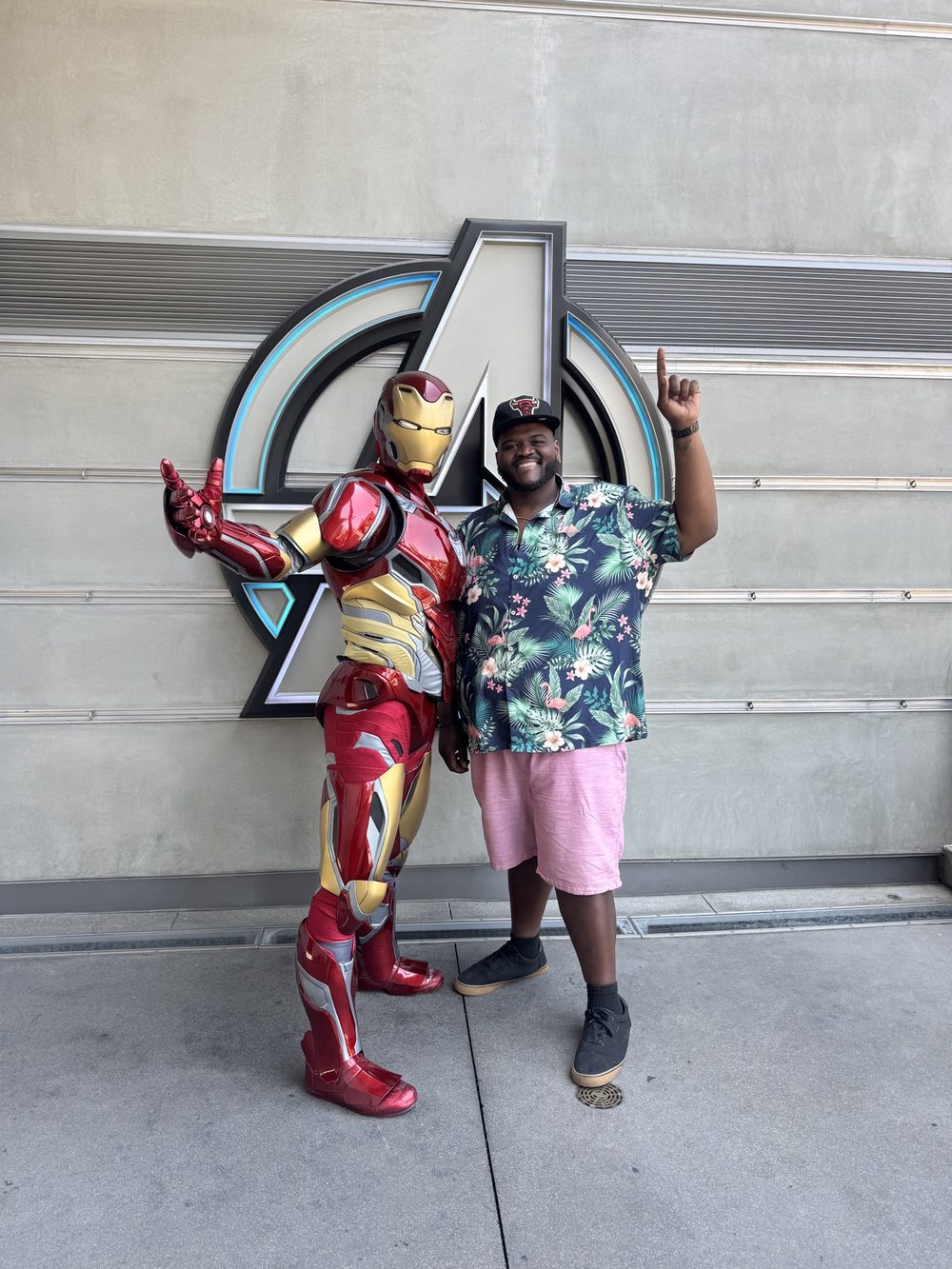 Tam posing with Iron Man at Avengers Campus, Disney California Adventure