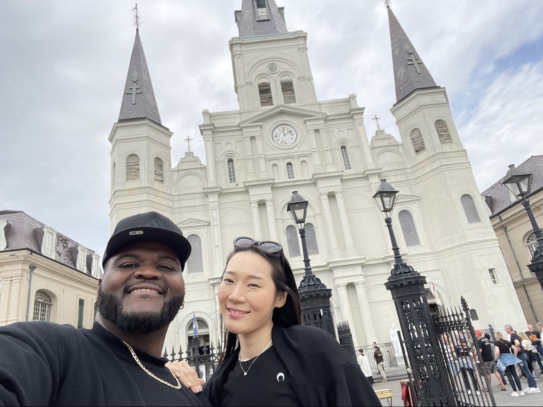 Tam and a friend in front of St. Louis Cathedral