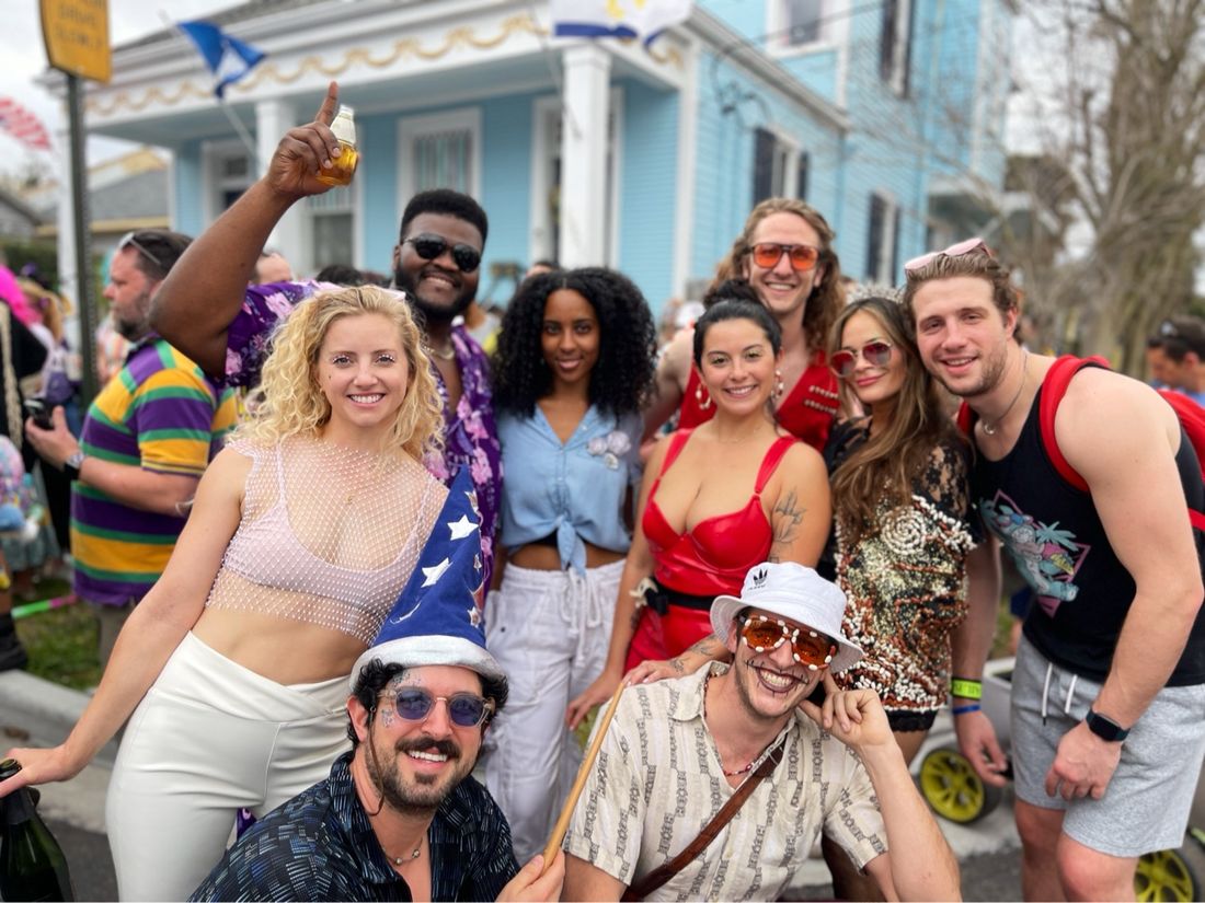 A costumed group of friends celebrating at Mardi Gras in New Orleans